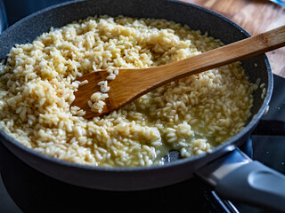 Cooking risotto in frying pan 