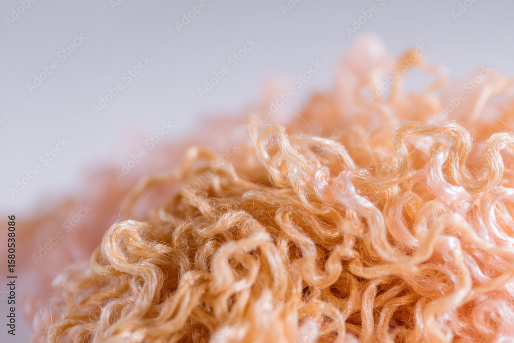 Poster curly wool fiber close up in soft light, showing elegant texture and natural beige color, creating c
