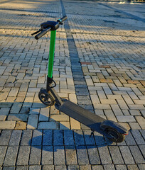 Electric Scooters Parked in a City Square