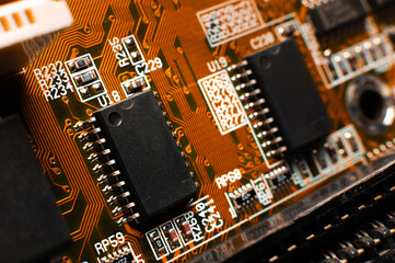 Printed circuit board, close-up. Small microprocessor, microcontroller on the motherboard of a...