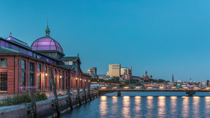 Fototapeta premium Hyperlapse of Altona Fish Market in Hamburg transition from day to night. Germany