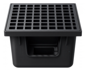 Industrial rainwater catch basin for a warehouse, equipped with a heavy-duty steel grate and a deep sediment trap.