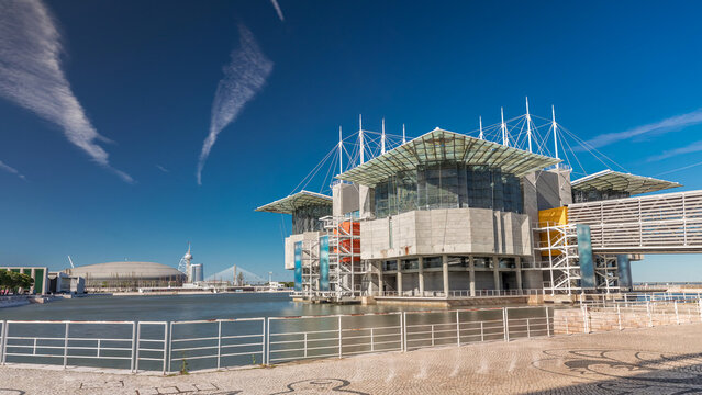 Lisbon oceanarium timelapse hyperlapse building on pier in an artificial lagoon at Tagus river estuary in parque das nacoes