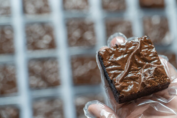 Close-up of Fuggy chocolate brownies in the lower right corner.