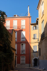 Colorful residential buildings with shutters in Perpignan, France