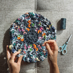 Top view of sewing recycled fabric rug