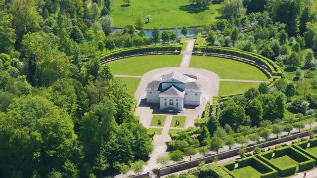 ch&acirc;teau seneffe adjacent theater building green parks surrounding art installation grounds nearby water bodies left to right pans aerial of de belgium 
