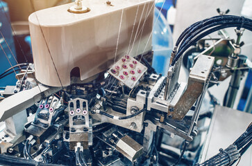 Part of sock production machine. Sock factory, automated process of automatic sock production.