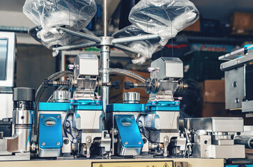 Textile industry, automatic knitting of socks. Machine for sewing the toe area of socks. Front view.