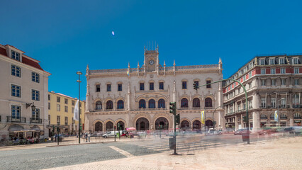 Rossio station in Lisbon timelapse hyperlapse. Front view with zebra crossing and street traffic.