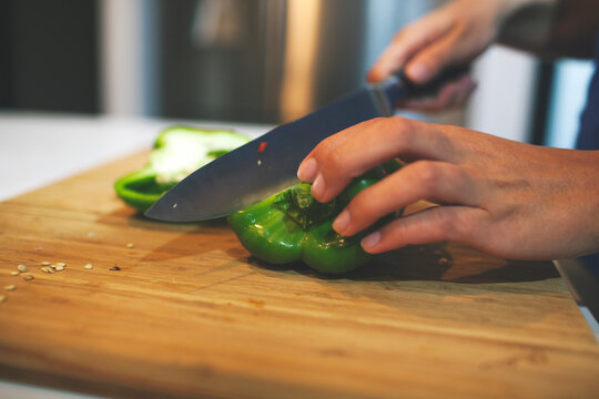 Capsicum being cut on a cutting board