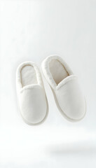 Pair of White Slippers on White Background Comfortable Footwear
