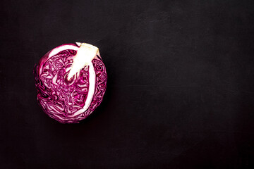 Red cabbage - head, cross section - on black background top view space for text