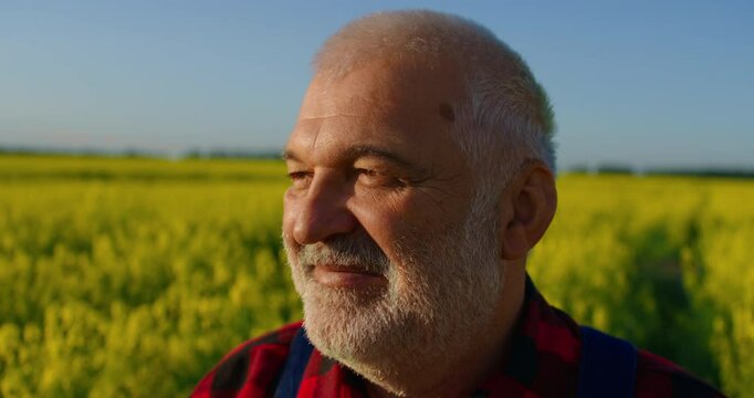 Portrait Of Happy Caucasian Farmer Smiling When Looking Around In Agricultural Fields In Summer
