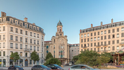 Obraz premium Hyperlapse of Place Antonin Jutard and the Mutuality Palace facade from the waterfront near Guillotiere Bridge in Lyon, France.
