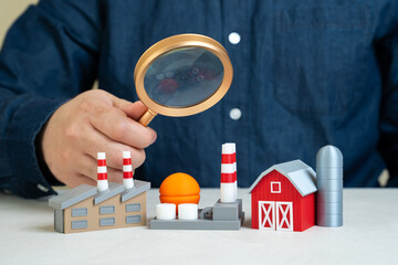 A man explores sectors of the economy. Analysis of economic structure, industrial contributions to...