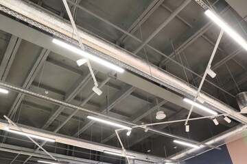An industrialstyle ceiling featuring track lighting that enhances modern aesthetics and ambiance