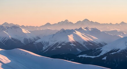 Snowy mountain range at golden hour