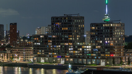 Panoramic aerial timelapse of Katendrecht peninsula at night and Maashaven harbour in Rotterdam,...