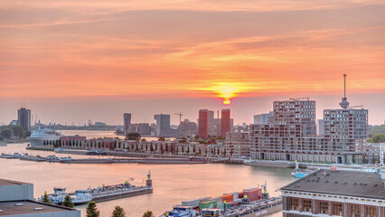 Aerial timelapse panorama of Katendrecht peninsula and Maashaven harbour at sunset in Rotterdam,...