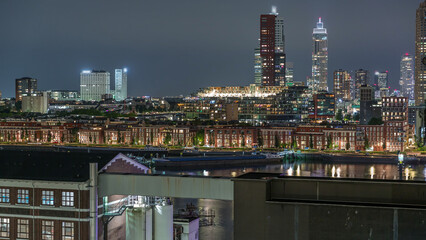 Panoramic night aerial timelapse of Katendrecht peninsula and Maashaven harbour in Rotterdam, The...