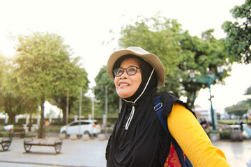 Smiling Woman Outdoors Travel on a Bright Day in at Malioboro, Yogyakarta