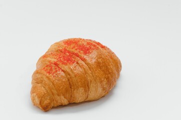 fresh baked croissant isolated on white background