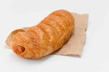 Sausage in dough .Isolated on white background