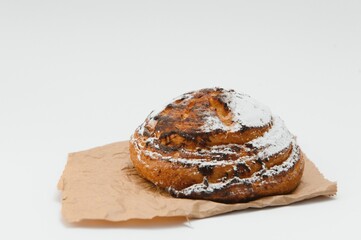 Sweet cinnamon bun roll swirl isolated over the white background