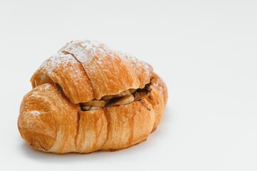fresh baked croissant isolated on white background