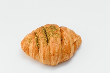 fresh baked croissant isolated on white background