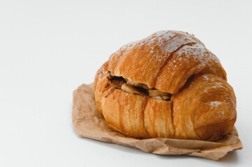 fresh baked croissant isolated on white background