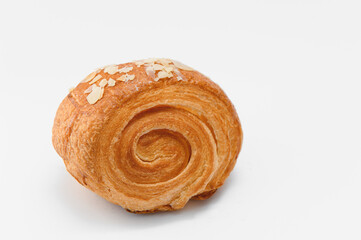 Sweet cinnamon bun roll swirl isolated over the white background