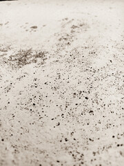 The texture of a white wall. It is vertical in black and white, vintage.