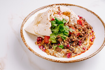 Delicious dish featuring seasoned meat, fresh ingredients, and herbs