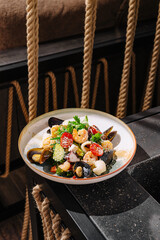 Fresh seafood dish served on a rustic dining table in a cozy restaurant
