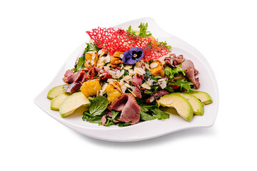 Elegant salad with mixed greens, smoked meat, and vibrant garnishes