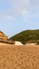 Golden hour paints the serene coastal landscape, echoing Earth Day reflections and spectral Samhain...