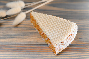 waffle with caramelized condensed milk on a wooden background