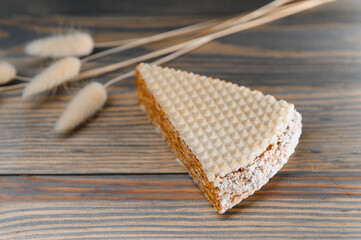 waffle with caramelized condensed milk on a wooden background