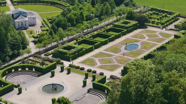 theater building ch&acirc;teau seneffe along decorated park fountains presence people walking ground revealing from left to right circles aerial drone of de 