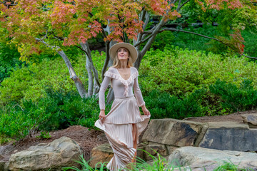 Autumn Elegance: A Stunning Model's Stroll Through Nature's Canvas
