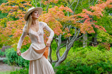 Autumn Elegance: A Stunning Model's Stroll Through Nature's Canvas