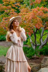 Autumn Elegance: A Stunning Model's Stroll Through Nature's Canvas