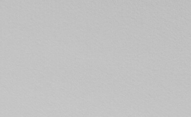 White felt abstract wall background. Surface of fabric texture in snow color. 