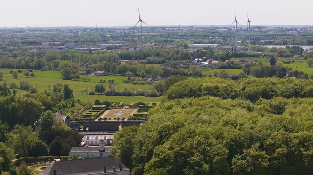 ch&acirc;teau seneffe vast area beyond buildings windmills fields town below create scenic backdrop from right to left pans aerial of de belgium 