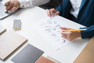 Interior designers brainstorming creative design ideas for modern home in collaborative meetingใ