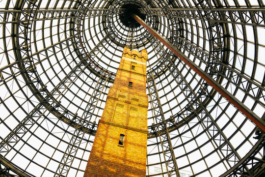 Fototapeta A brick tower under steel scaffolding