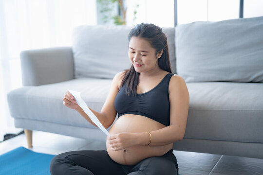 Pregnant asian woman holding ultrasound baby Image Result from Doctor. Happy mother mindfulness Positive life moment in pregnancy time. health care
