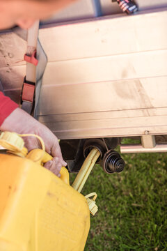 Filling a truck with diesel fuel from a jerry can
